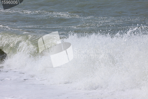 Image of wave and spray on the French Normandy coast