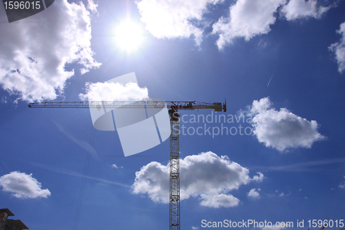 Image of Construction crane against the blue sky 