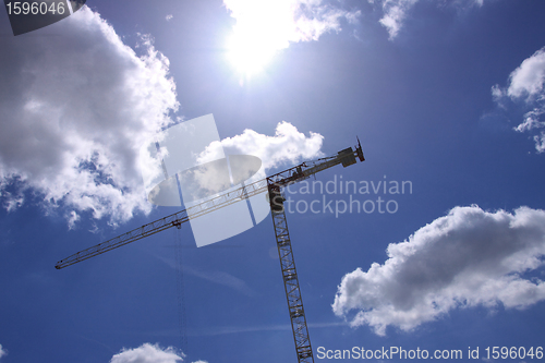 Image of Construction crane against the blue sky 