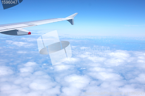 Image of clouds and blue sky seen from plane