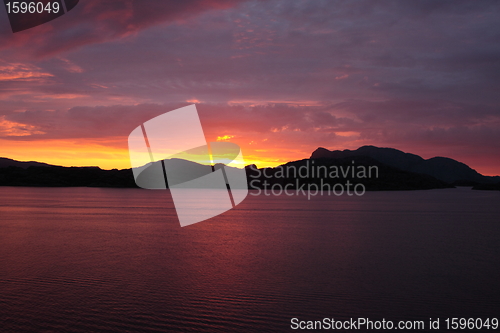 Image of sunset view from a boat off the coast of norway