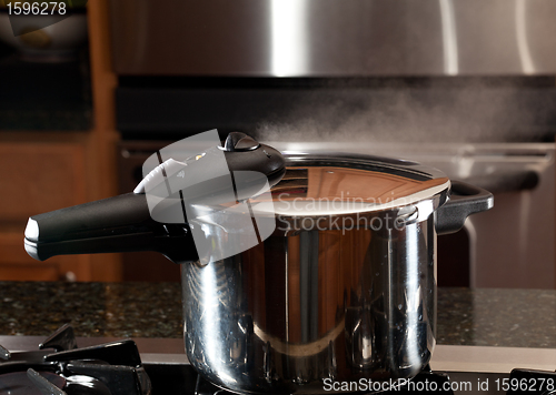 Image of Steam escaping from new pressure cooker pot
