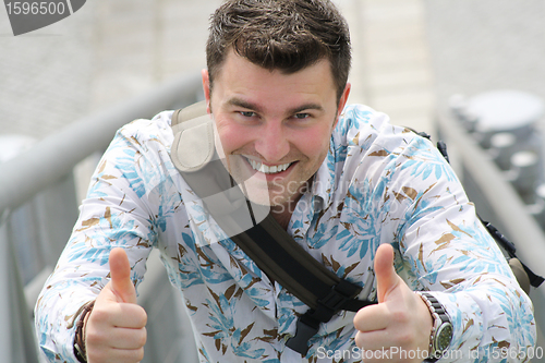 Image of Young man with thumbs up