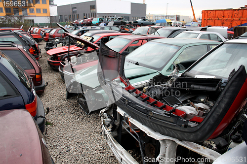 Image of Cars in front of the scrap