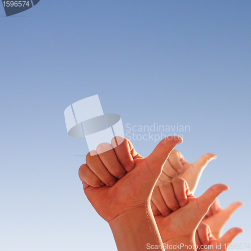 Image of hands on a blue background