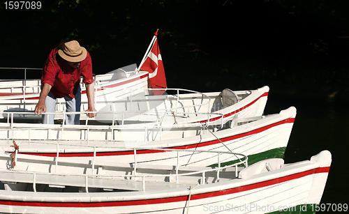 Image of  man and boats