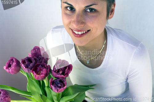 Image of  woman holding flowers