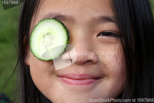 Image of child and cucumber