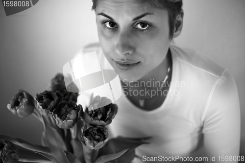 Image of woman holding flowers