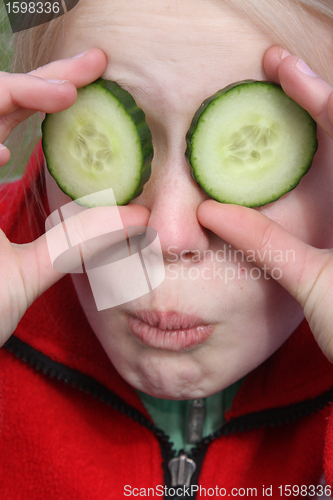 Image of child and cucumber