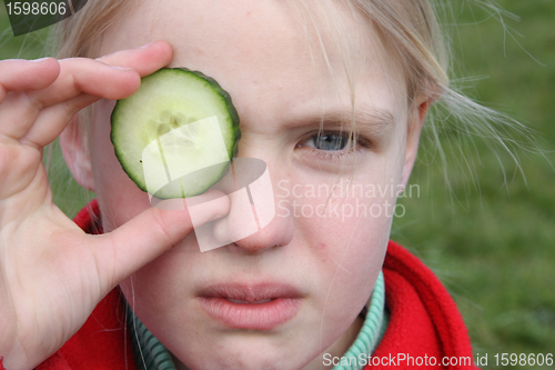 Image of child and cucumber