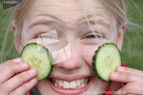 Image of child and cucumber