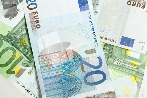Image of Euro banknotes arranged in background