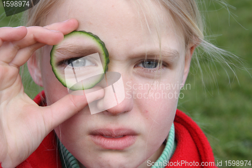 Image of child and cucumber