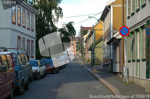 Image of Street with small houses and cars