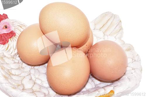 Image of Eggs brown on hen nest Easter