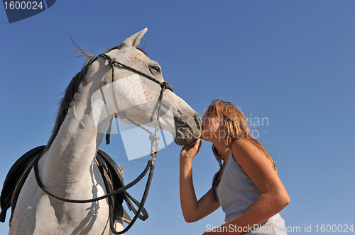 Image of teen and arabian horse