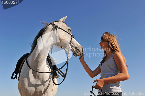 Image of teen and arabian horse