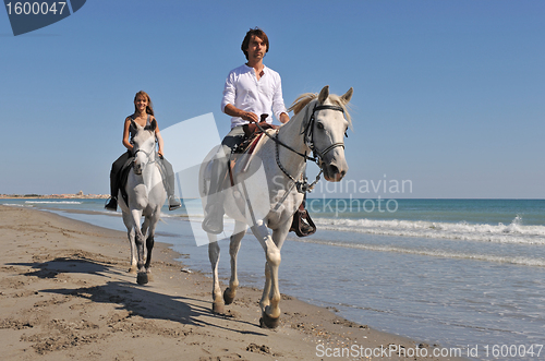 Image of horseback riding on the beach