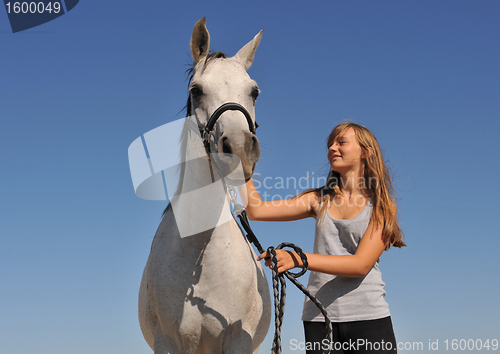 Image of teen and arabian horse