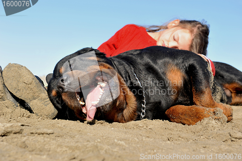 Image of child and rottweiler