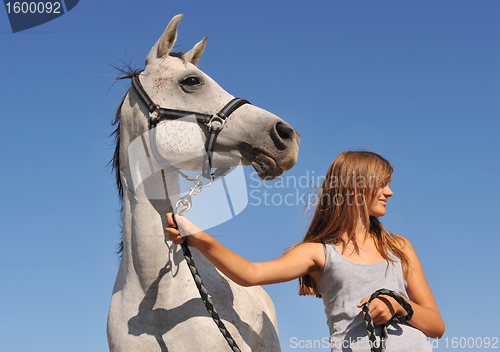 Image of teen and arabian horse