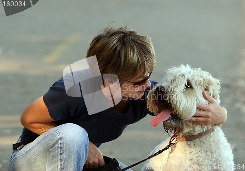 Image of Woman with her dog in the park