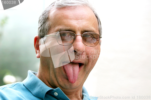 Image of Mature man with his tongue out