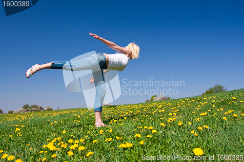 Image of young woman exercising yoga