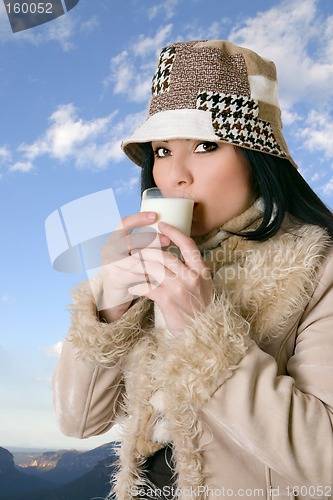 Image of Female with glass of milk
