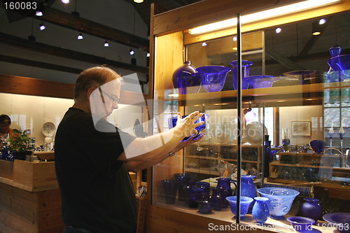 Image of Man bying Coblat Blue Glass.