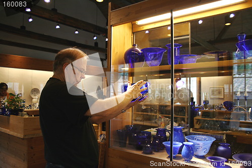 Image of Man bying Coblat Blue Glass.