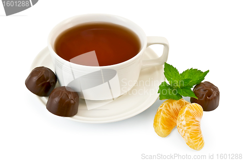 Image of Tea with candy and mint