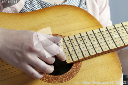 Image of Playing the guitar