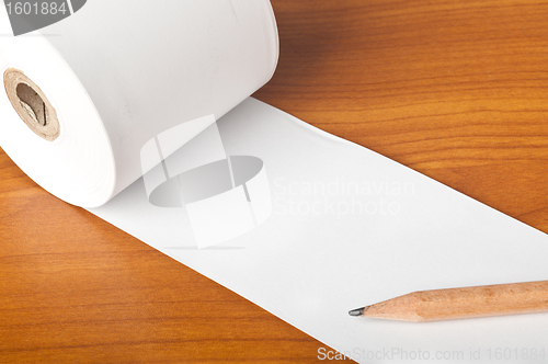 Image of Roll of paper and pencil