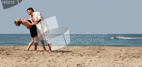 Image of Couple dancing on the beach