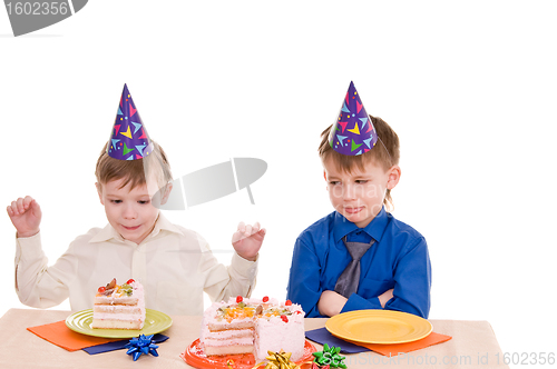 Image of two boys with cake