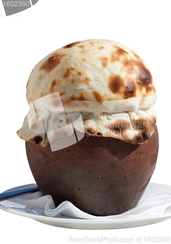 Image of Clay pot covered with bread