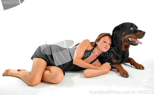 Image of sleeping woman and rottweiler