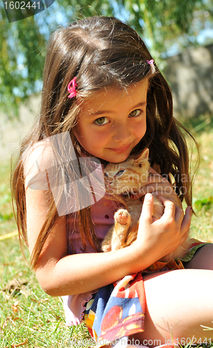 Image of little girl and kitten