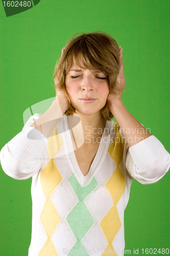 Image of  pretty woman covering her ears 