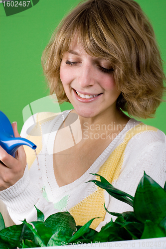 Image of girl watering flowers