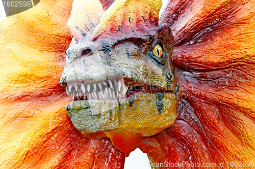 Image of Dilophosaurus dinosaur with orange collar