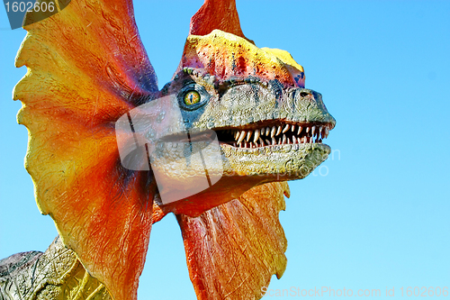 Image of Dilophosaurus dinosaur with orange collar