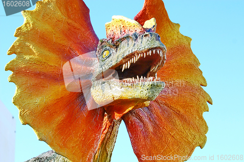 Image of Dilophosaurus dinosaur with orange collar