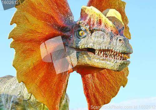 Image of Dilophosaurus dinosaur with orange collar