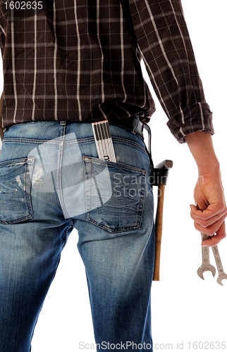 Image of Construction worker with wrenches