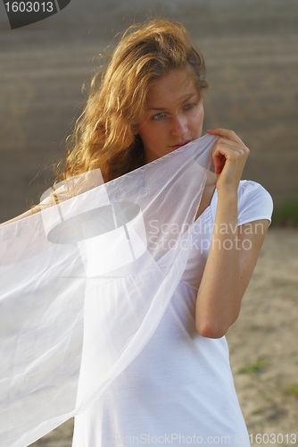 Image of Young woman with white scarf