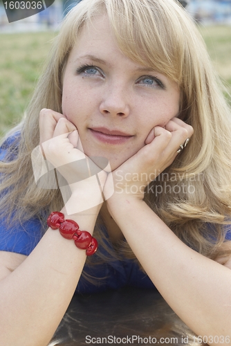 Image of Woman lying on grass