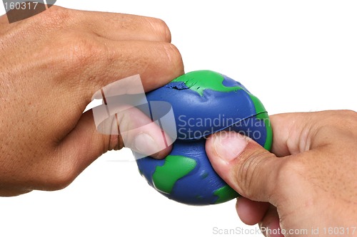 Image of Hands Squeezing Earth